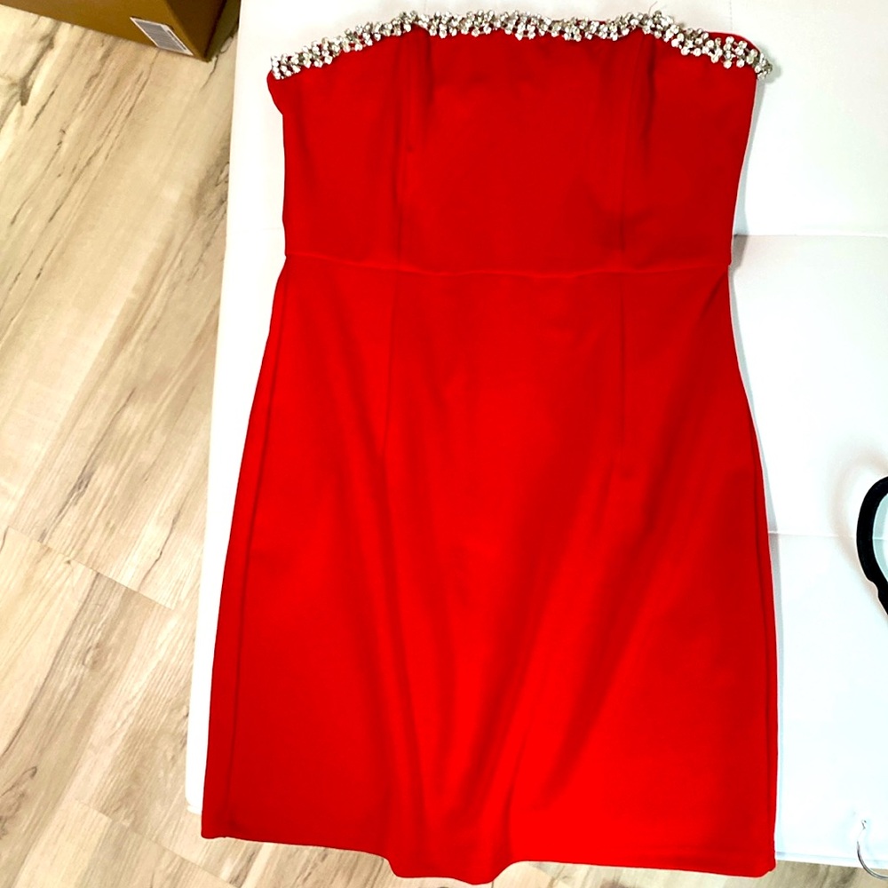 Beautiful red mini dress with jewel embellishments.